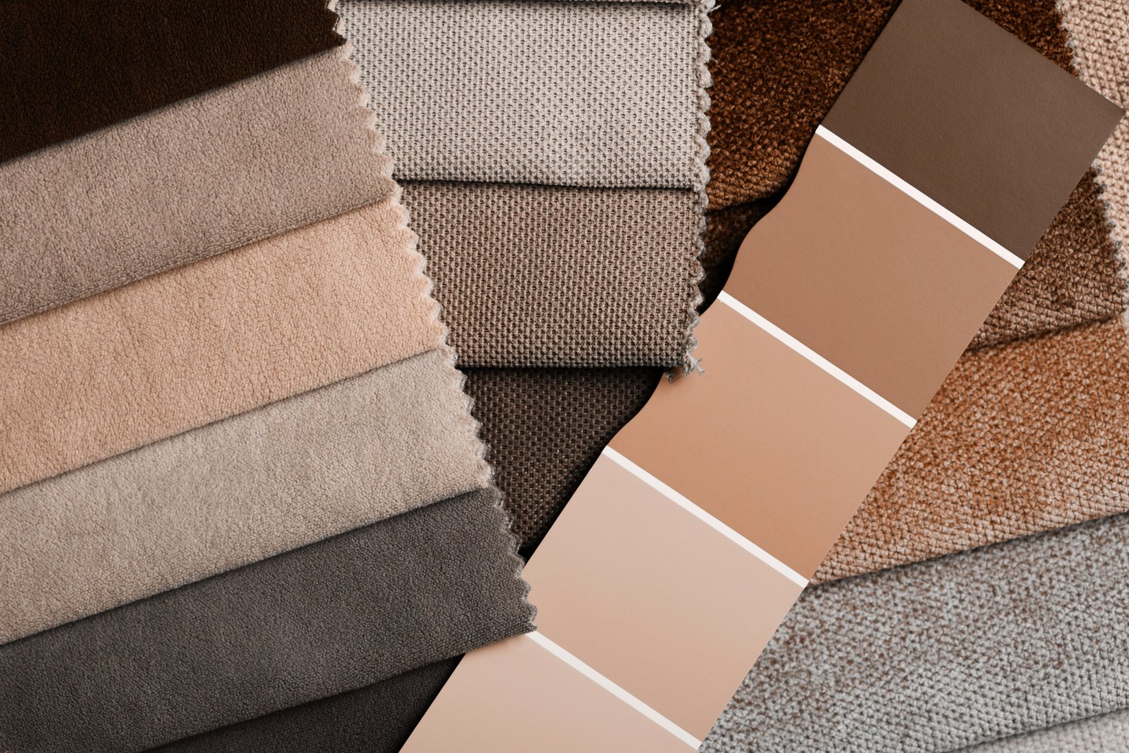 a variety of fabrics with a color palette. New trending PANTONE Peach Fuzz colour of 2024 year